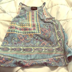 Cute halter top with button detail.